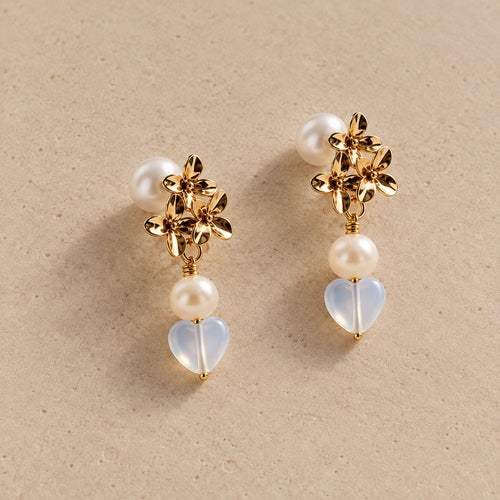 The Fiona gold floral pearl and opalite heart drop earrings by Nacre & Atlas