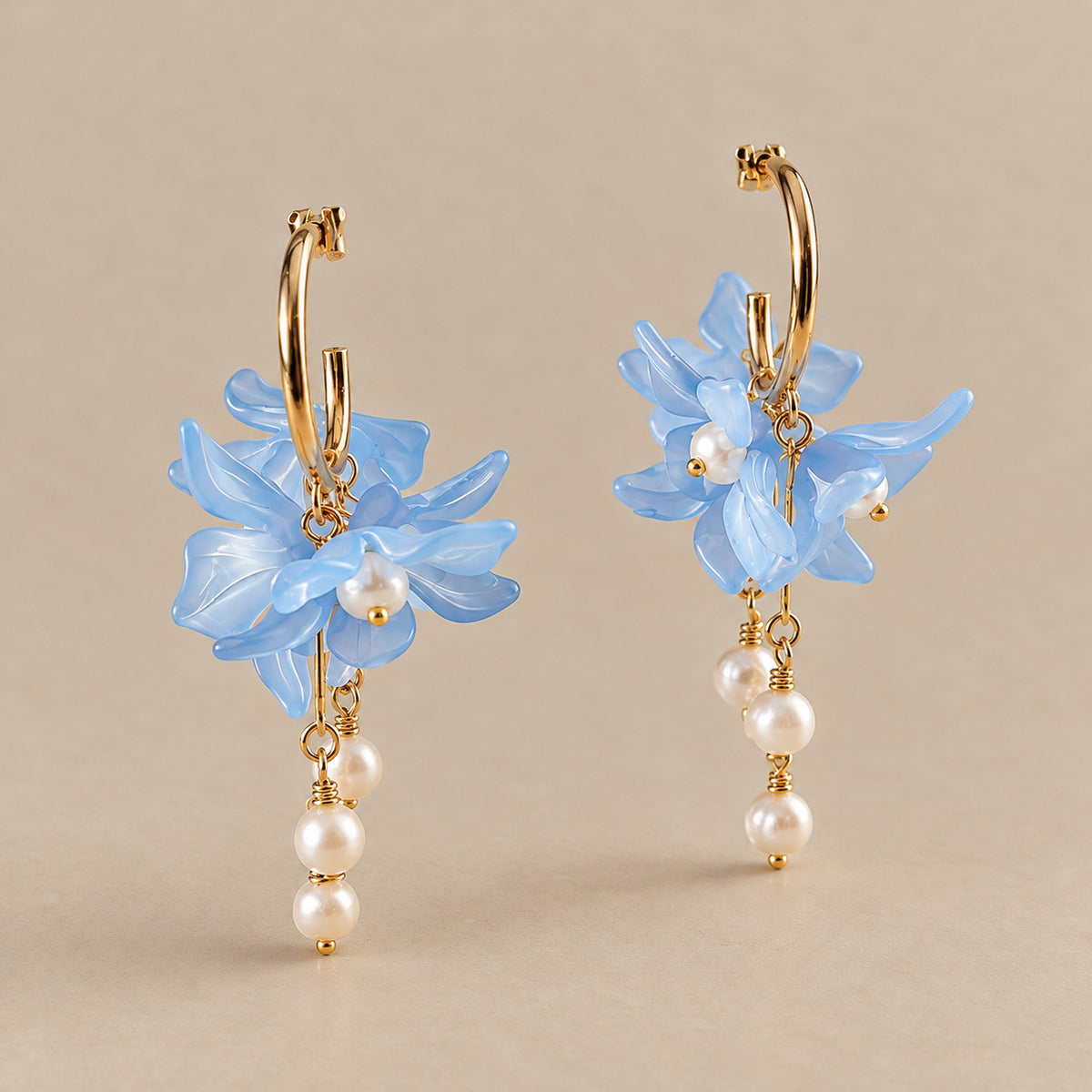 The Flora blue floral pearl drop earrings by Nacre & Atlas