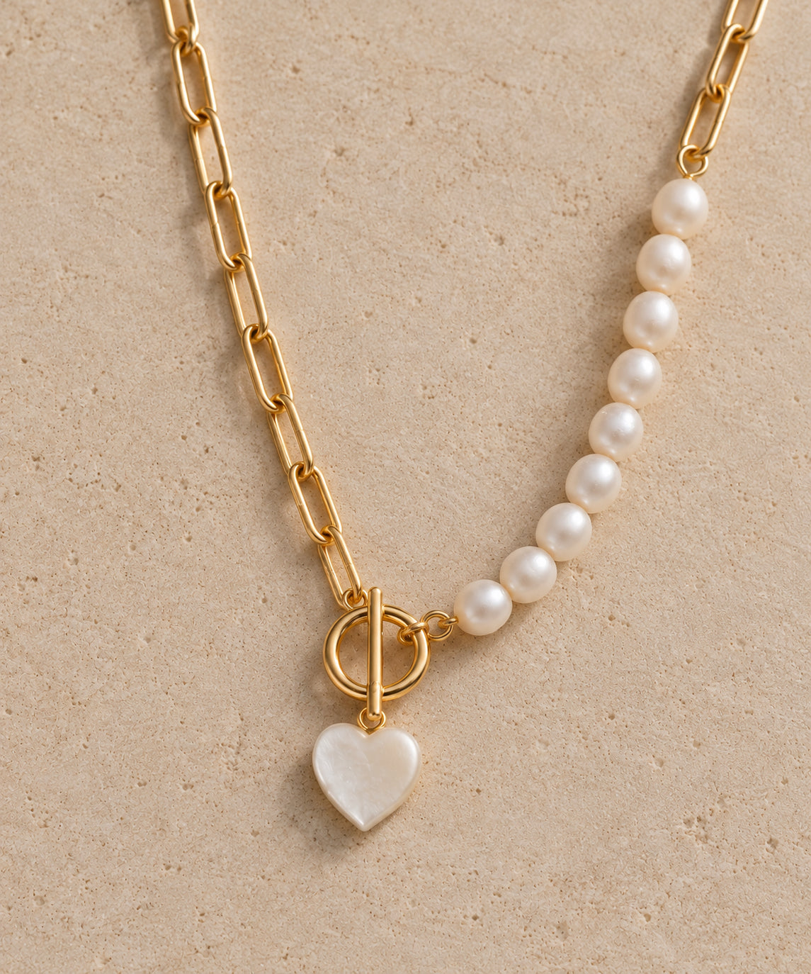 The Mable pearl and gold-tone chain necklace with iridescent heart charm by Nacre & Atlas